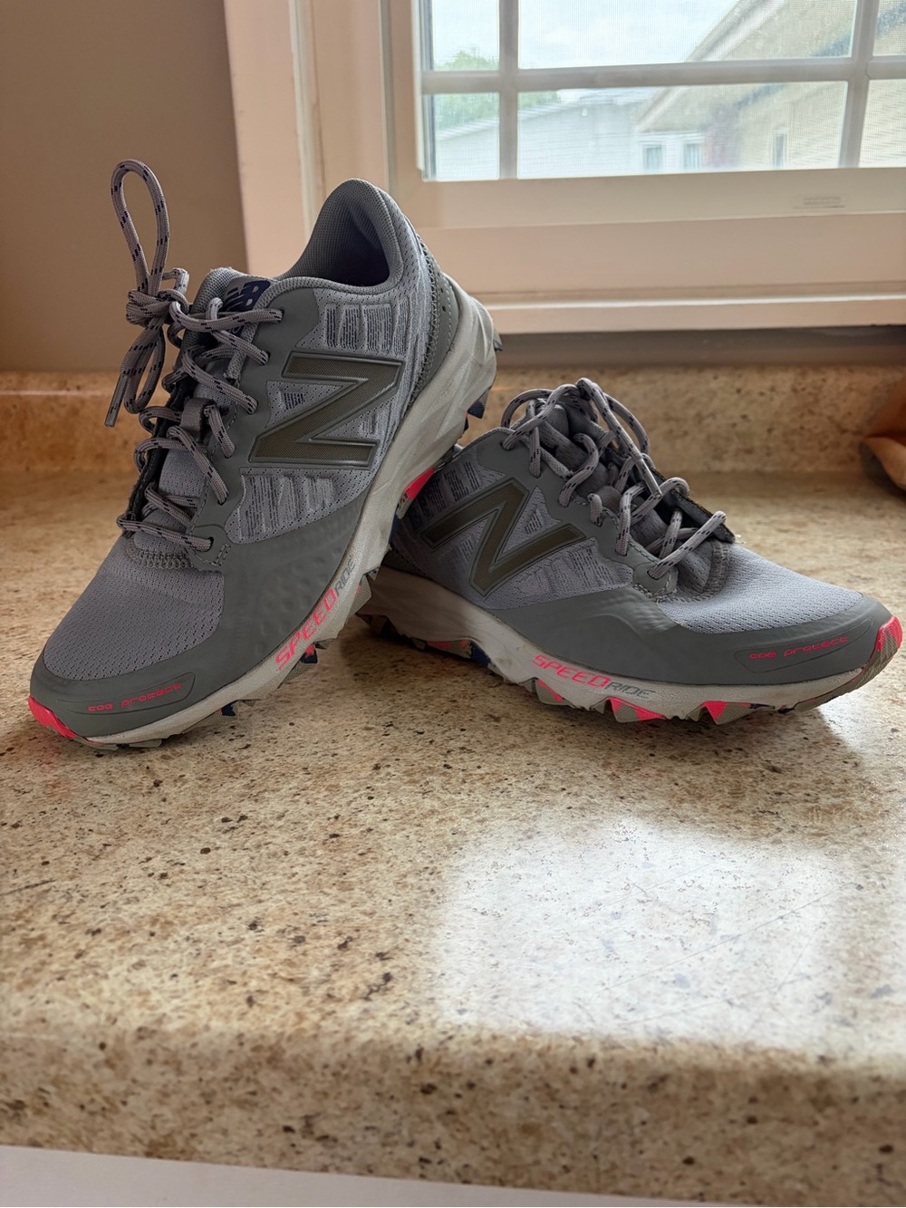 New Balance Women's Gray Trail Runners with Pink Highlights